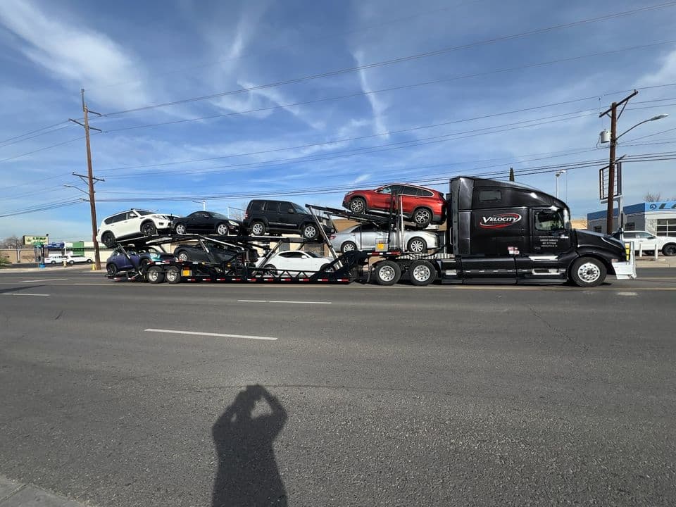 Velocity Logistics semi car hauler loaded with cars on both decks